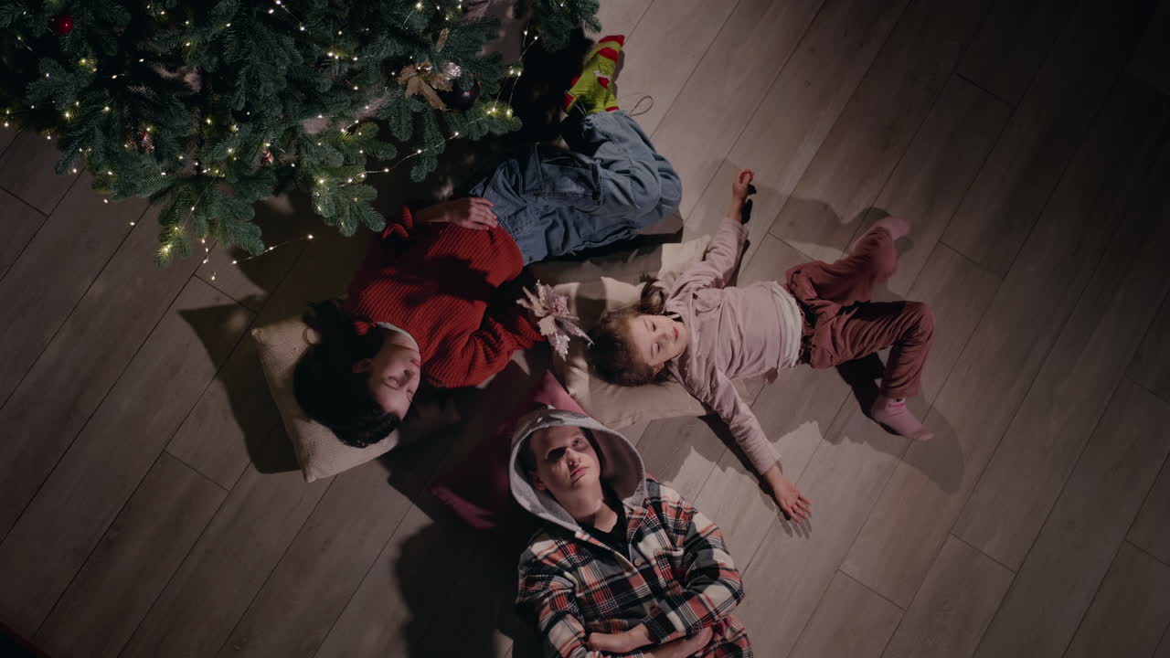 Children Lying Under Christmas Tree