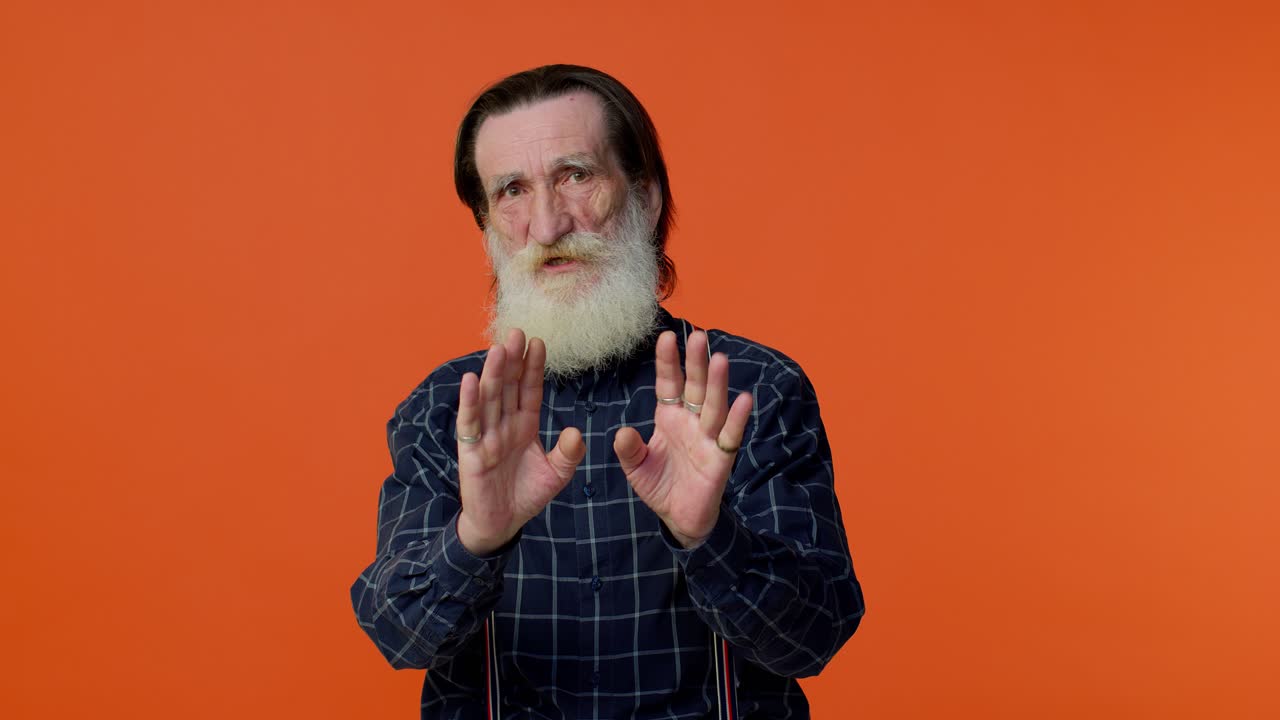 Confused senior old bearded man pointing fingers himself ask say who me no thanks i do not need it