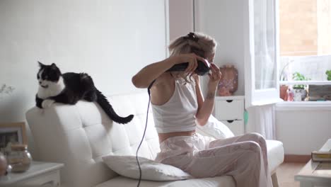 tender woman doing hairstyle at home