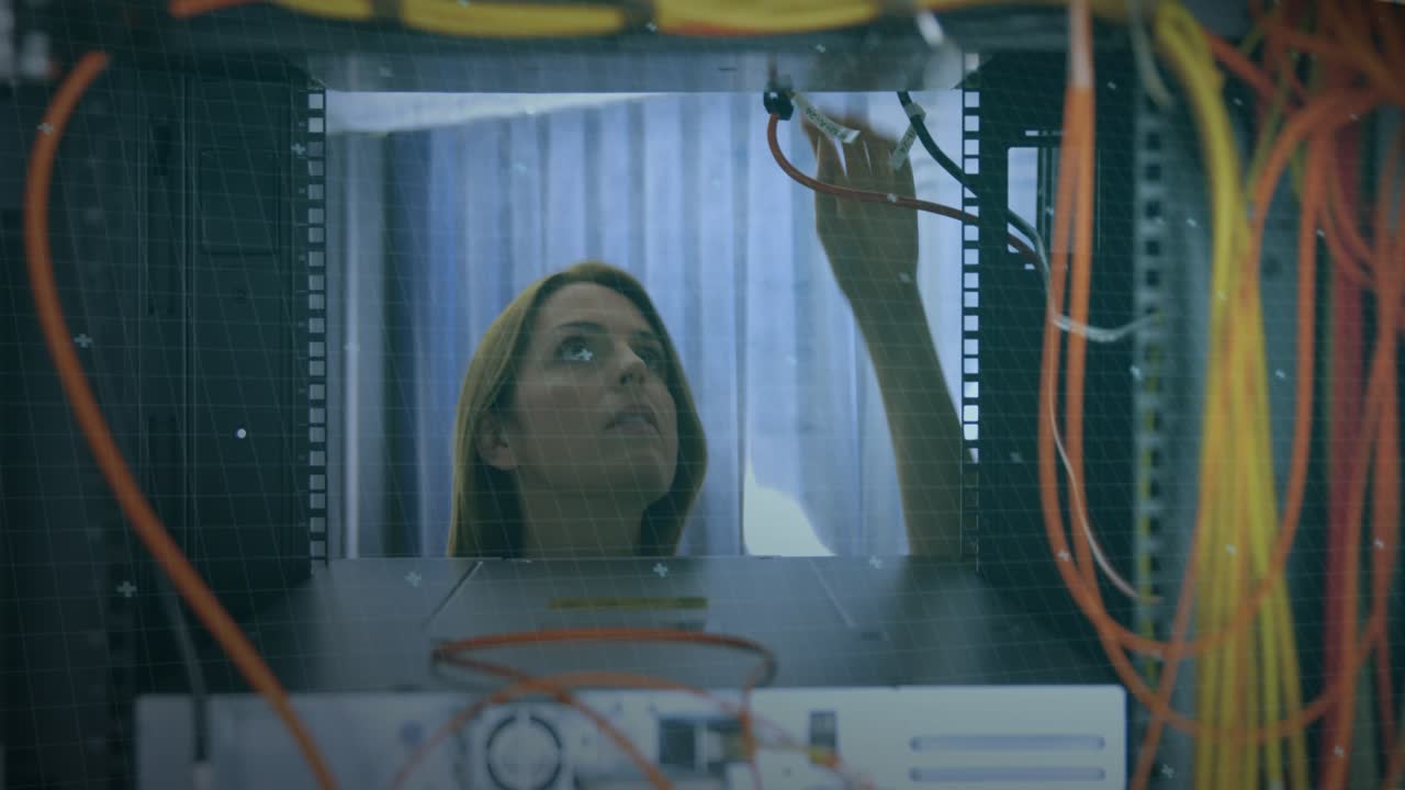 Animation of data processing over caucasian woman checking computer wires