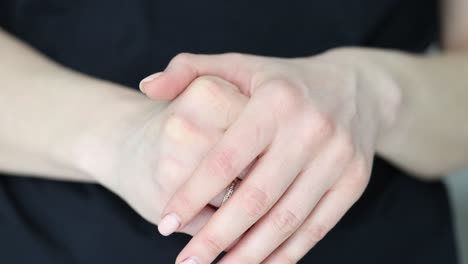 close-up of a person's hands with a ring