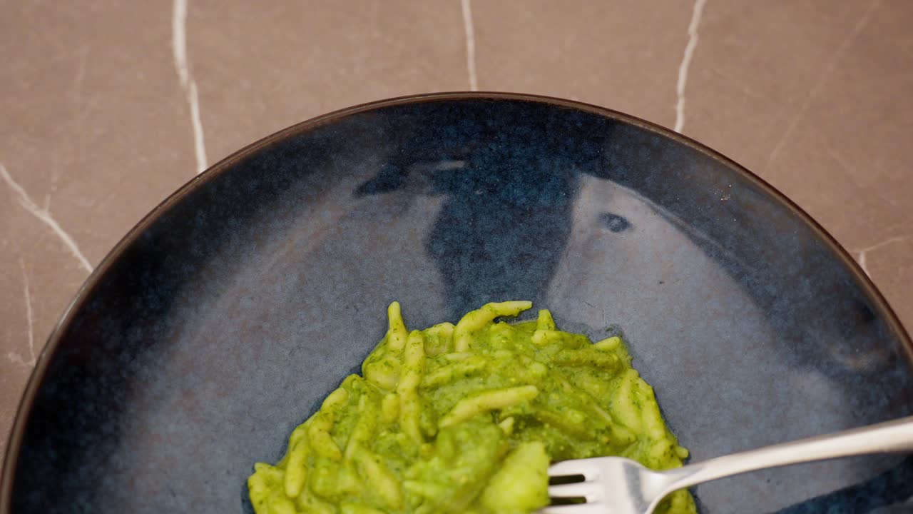 A serving of pasta al pesto, a traditional Genoese dish made with fresh basil