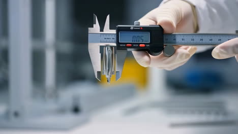 precision measurement with a digital caliper in a laboratory setting