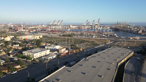 aerial view of a busy commercial seaport and freeway