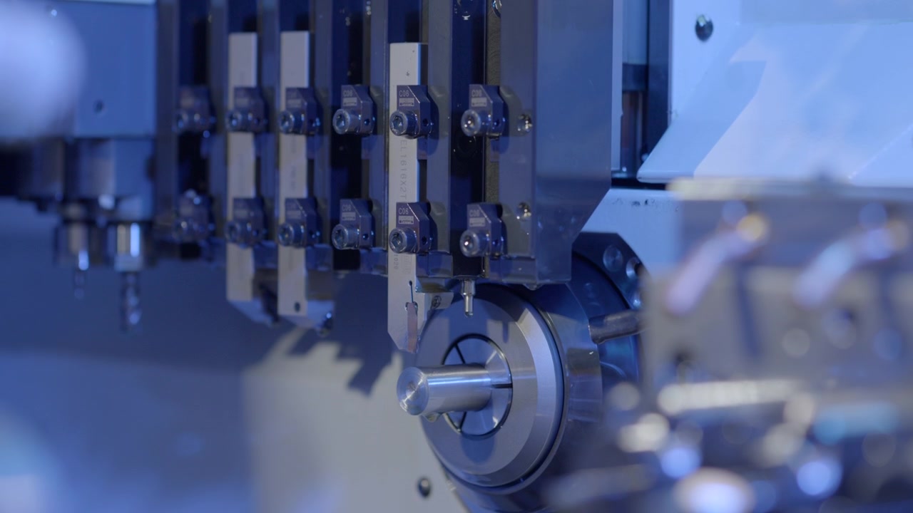Close-up of a CNC machining tool aligning with a metal component in a futuristic manufacturing environment.