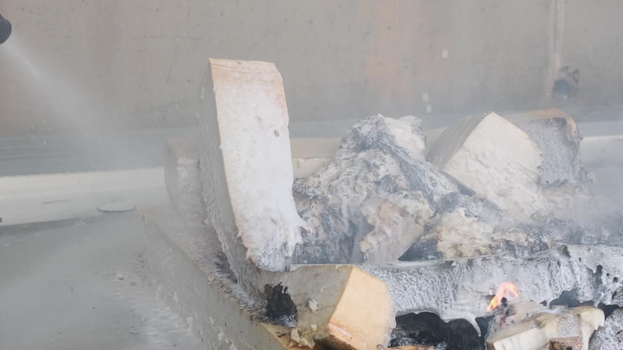 Final Stage of Fire Suppression with Water and Foam