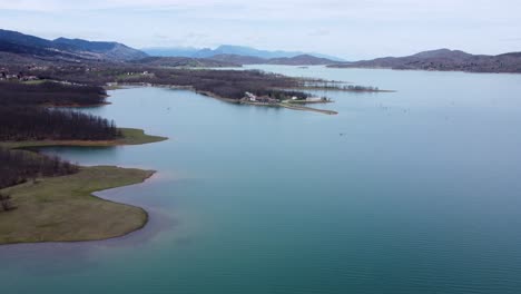 Aerial-footage-over-lake-shoreline