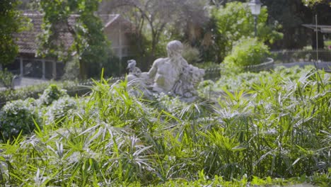 nature garden park statue heritage travel sunny birds blue sky pigeon green old building portugal lisbon traveling shot