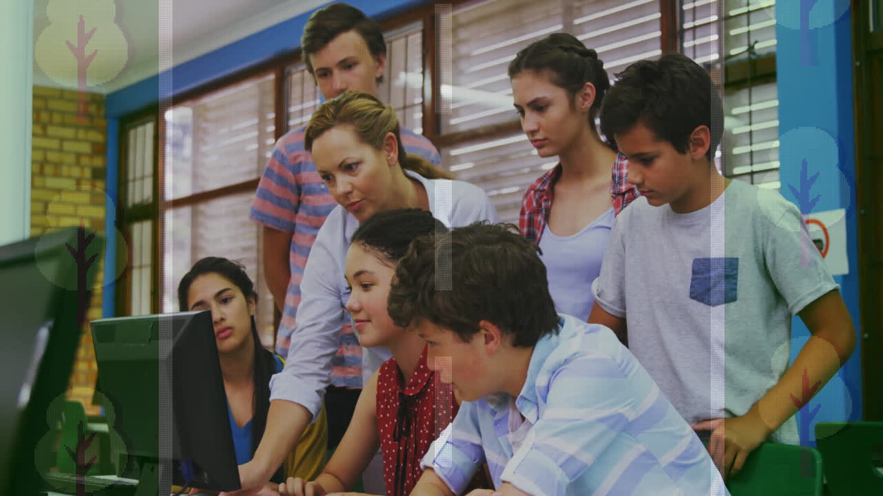 Female teacher leaning over desktop PC guiding students in education, with floating data icons
