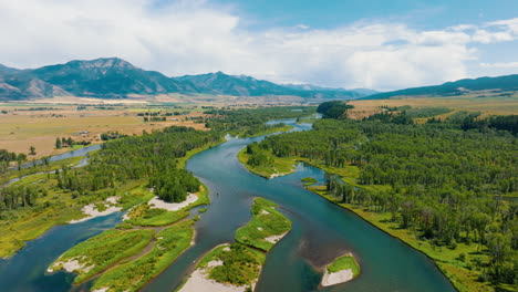 aerial view of a winding river through a mountain valley