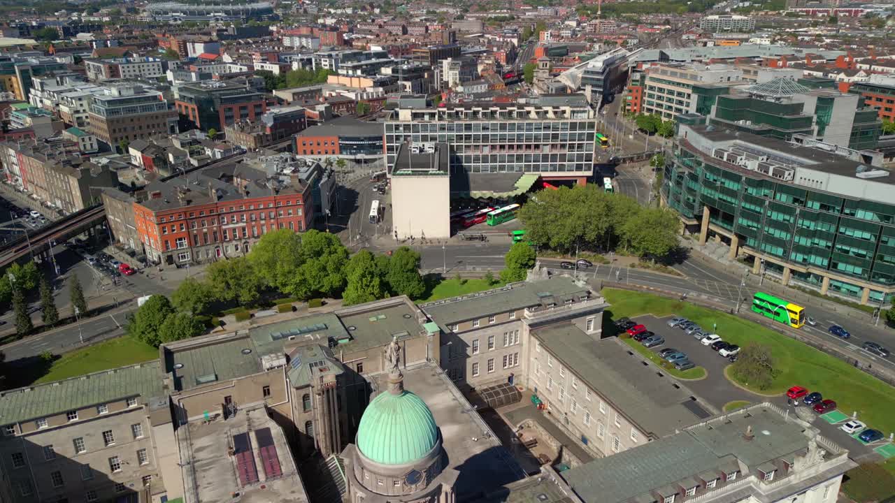 Advancing overhead aerial video of Custom House, the River Liffey and the surrounding area in Dublin, Ireland, on a bright and sunny day. Filmed in 4K, 60FPS and with Rec709 color.