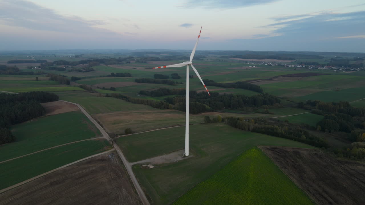 Aerial drone view of Beautiful Windmill Turbine Harnessing Clean, Green, Wind Energy