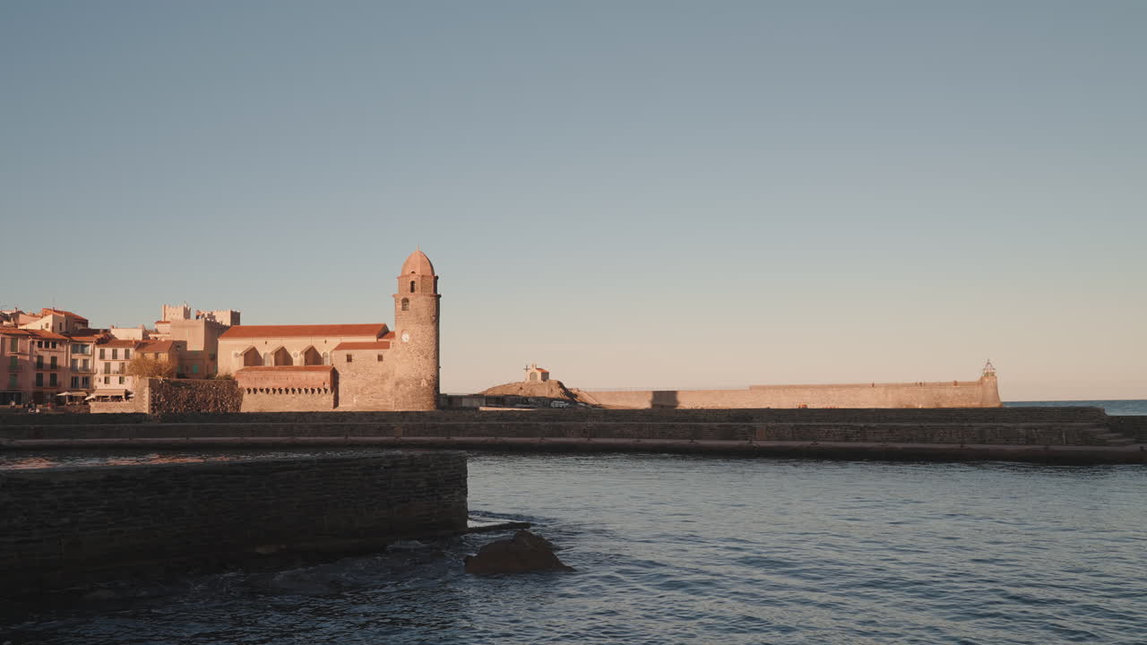 Serene Collioure waterfront, majestic &Eacute;glise Notre-Dame in the background