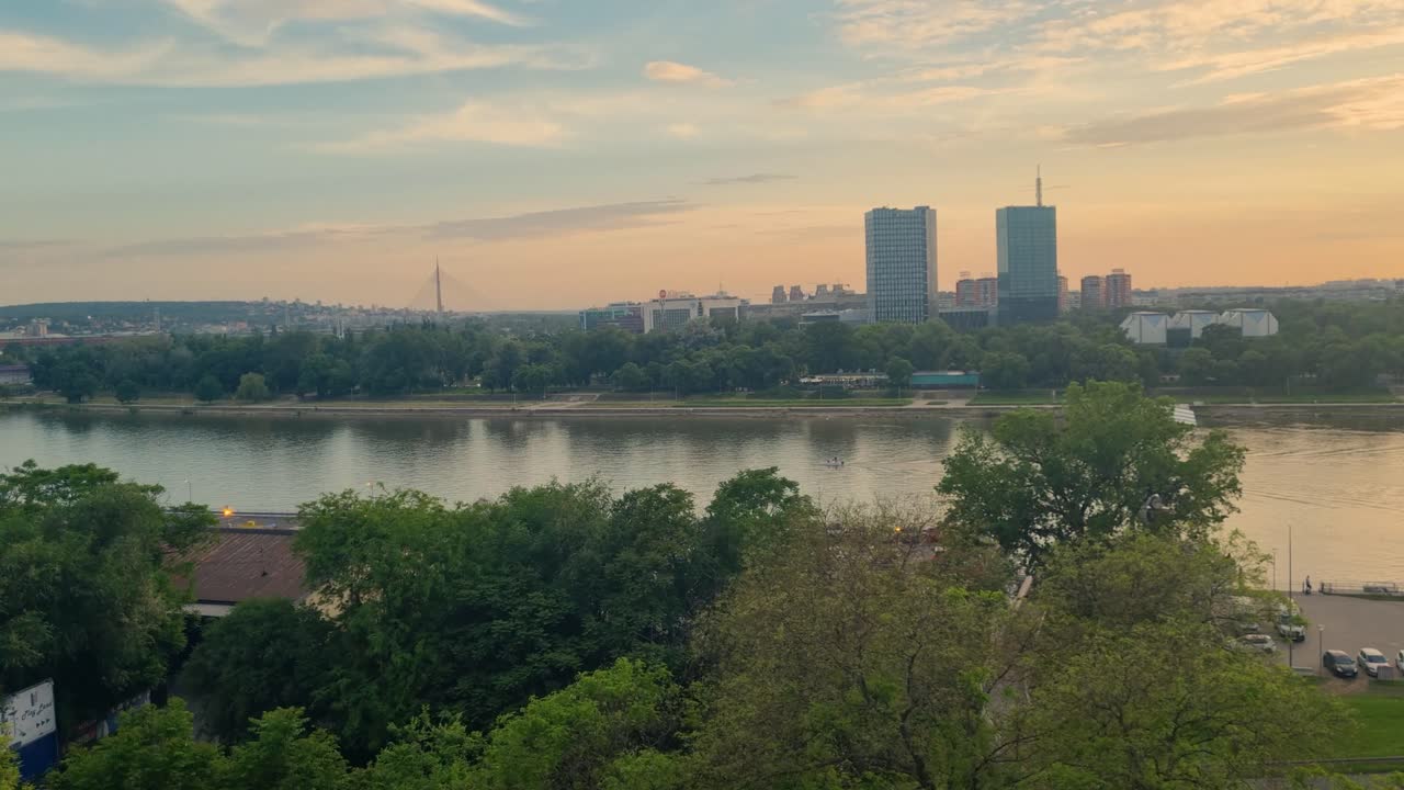 Golden hour view from Kalemegdan Fortress over New Belgrade and the calm Sava River at sunset