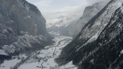 Drone-Aerial-of-Lauterbrunnen-surrounded-by-the-Mountain-Eiger-in-the-swiss-alps