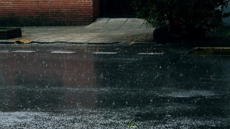 Raindrops Splashing on a Wet City Street