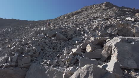 Hiker-ascending-scrambling-wide-crab-Kananaskis-Alberta-Canada