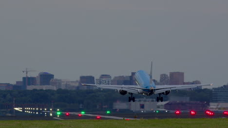 airplane landing at airport in city