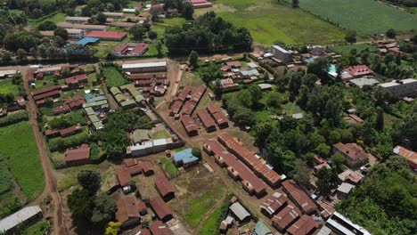 bird's eye view of low-income houses in the rural town of loitokitok, kenya - aerial drone shot