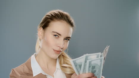 Young-business-woman-counting-cash-money-in-slow-motion.-Woman-counting-cash