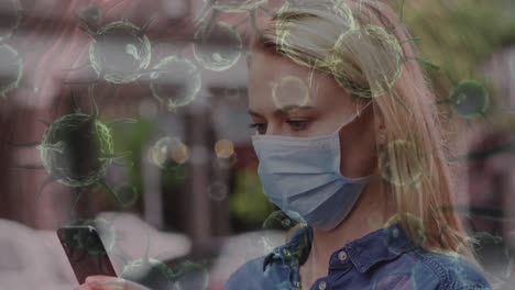 animación de células de covid-19 que se mueven sobre una mujer con máscara facial