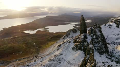 Drone-shot-over-the-snowcapped-Old-Man-of-Storr,-Skye,-Scotland