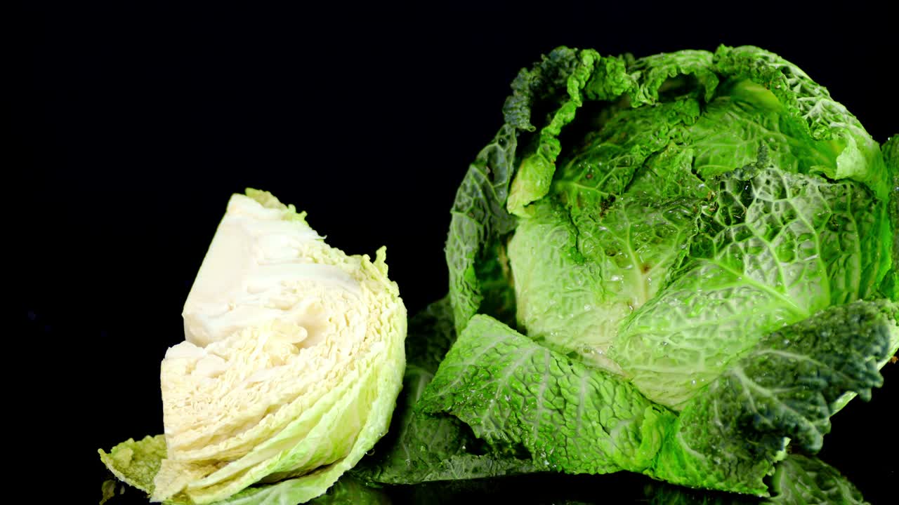 A piece of fresh cabbage falls into the water.