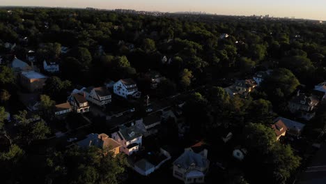 flying over a suburban area with manhattan in the backround