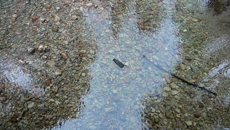 static shot of rippling clear water at dusk