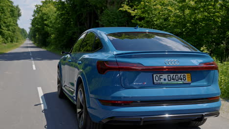 audi e-tron full electric car. new audi e-tron fully electric vehicle on road