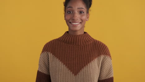 Beautiful-woman-in-cozy-brown-sweater-smiling