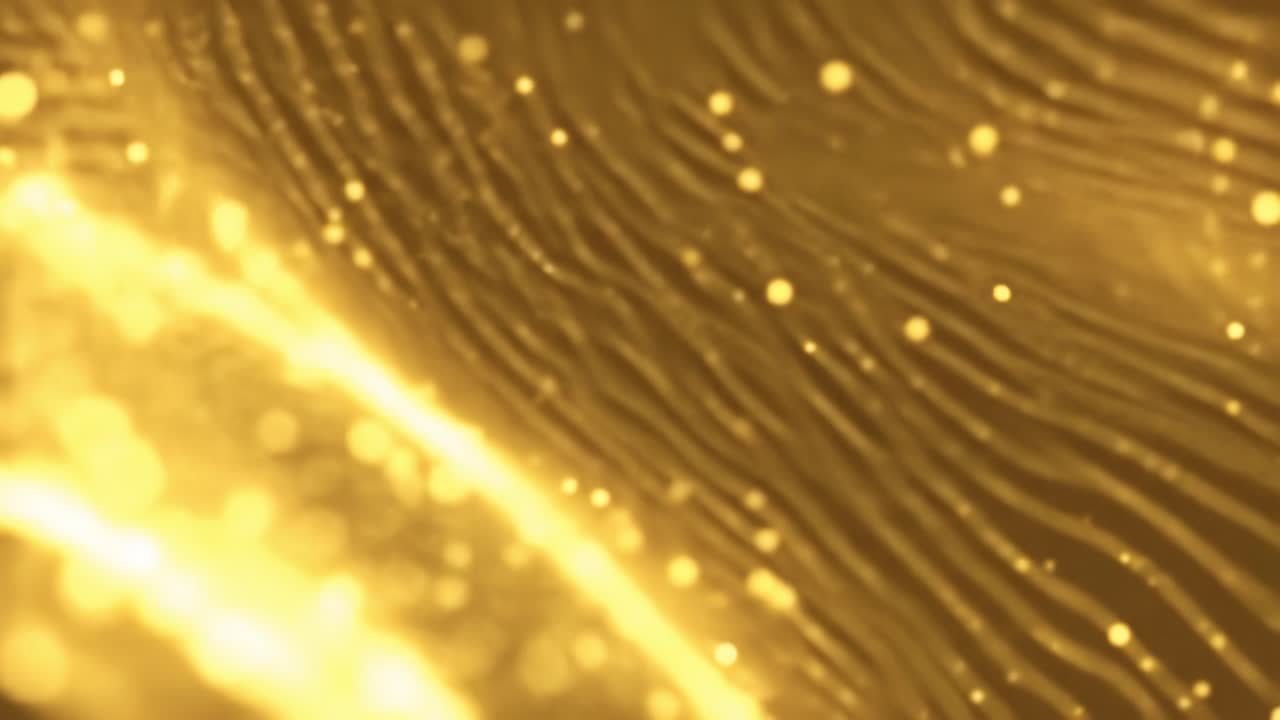 Golden particles gracefully move and shimmer against a dark backdrop, creating a captivating display of light and texture. This enchanting visual draws in viewers with its radiant beauty.