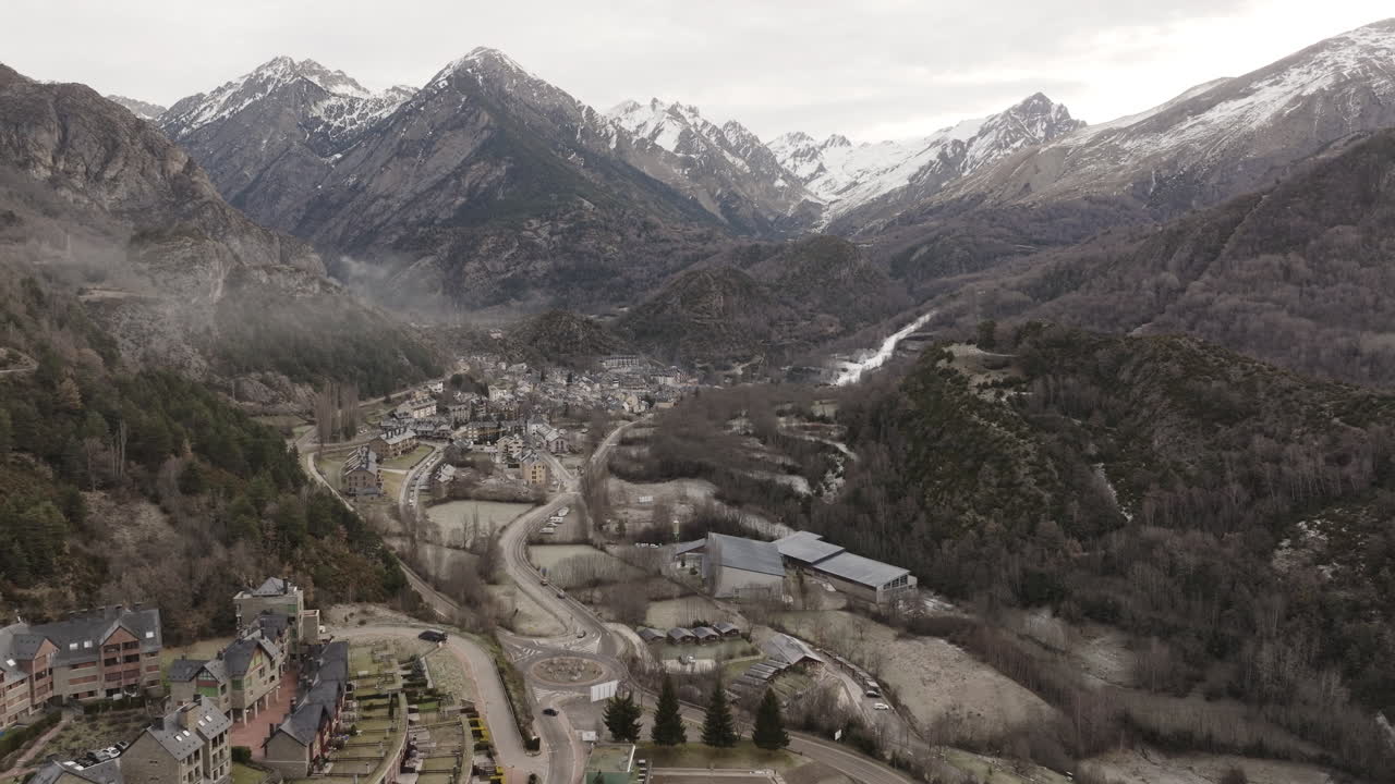 Aerial view of a winter village nestled in the mountains