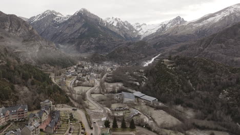 aerial view of a winter village nestled in the mountains