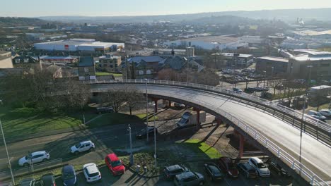 Busy small town centre curved road and police van