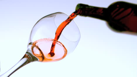 red wine pouring into glass low angle view