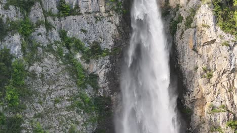 the fiery rush of water cascading down the cliffs at seerenbachfälle in amden betlis, walensee, switzerland, illustrates the dynamic force and natural wonder of the swiss landscape