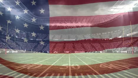 american flag waving in a full stadium background