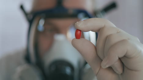 young doctor or pharmacist shows a pill and turns his head negatively. improper treatment