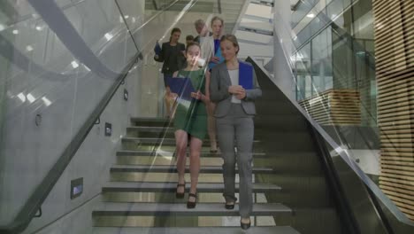 Animation-of-escalator-over-business-people-talking-in-modern-office