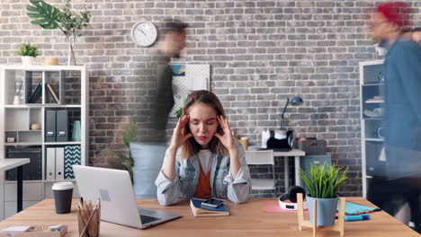 overwhelmed employee in busy office