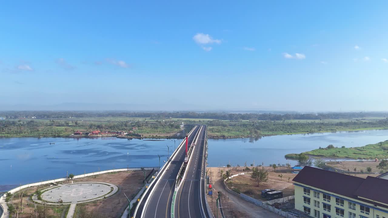 Aerial view of Kretek II Bridge on the estuary Opak River. Yogyakarta, Indonesia. 4K drone footage.