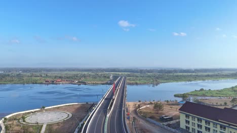 aerial view of kretek ii bridge on the estuary opak river. yogyakarta, indonesia. 4k drone footage.