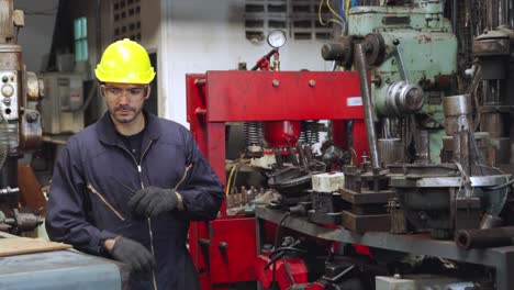 young factory worker or engineer close up portrait in factory