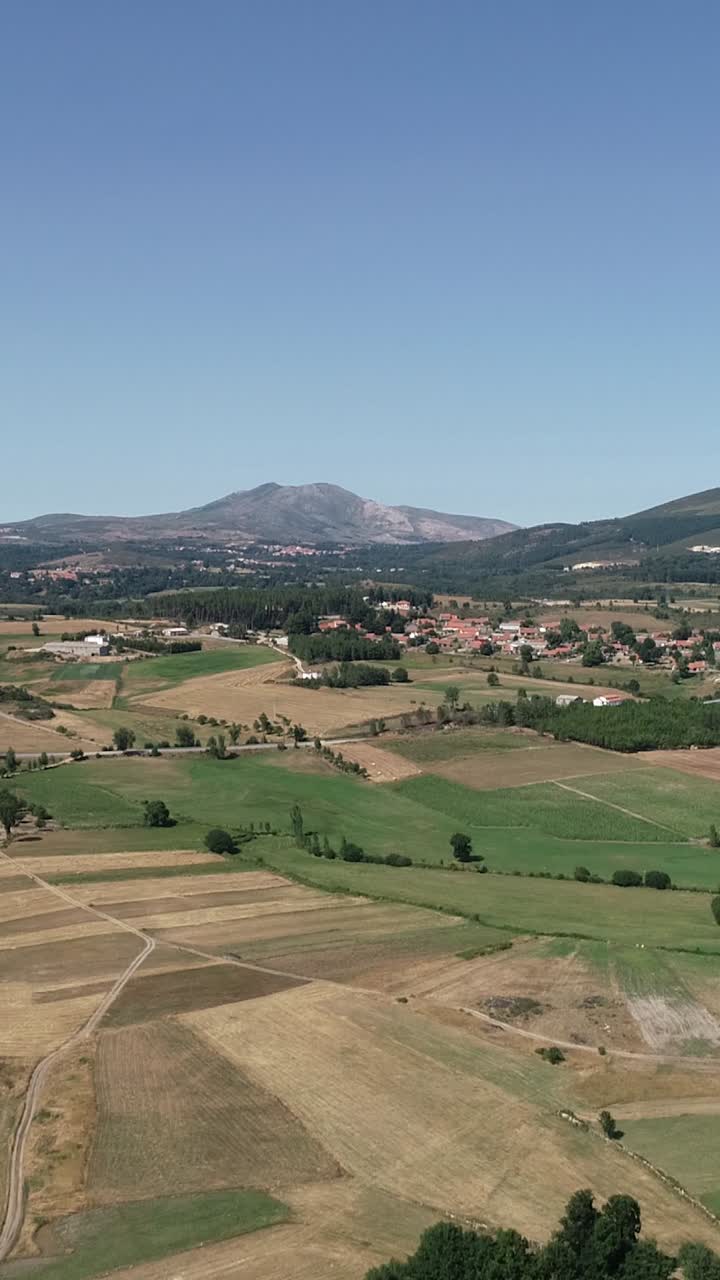 Aerial View of Serene Rural Landscape with Mountains