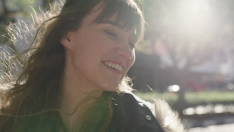 close-up-portrait-of-beautiful-cute-young-woman-laughing-cheerful-looking-optimistic-on-sunny-urban-sidewalk