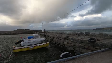 small fishing boats are located at the harbor