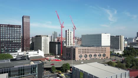 Aerial drone flight alongside the Mancunian Way in Manchester City Centre with moving traffic below