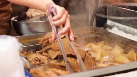 vendor preparing traditional hong kong street food