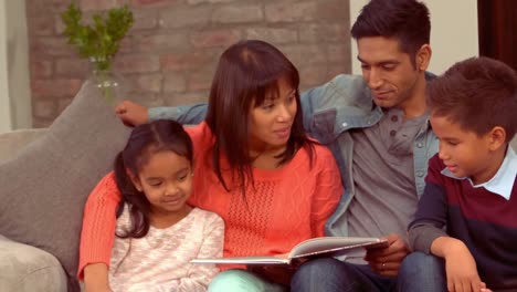 smiling hispanic family in the living room
